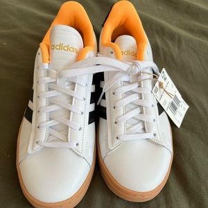 Never been worn brand new Adidas sneakers with super cute pop of orange.Size 7.5